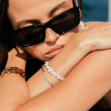Woman wearing sunglasses with freshwater pearl bracelets